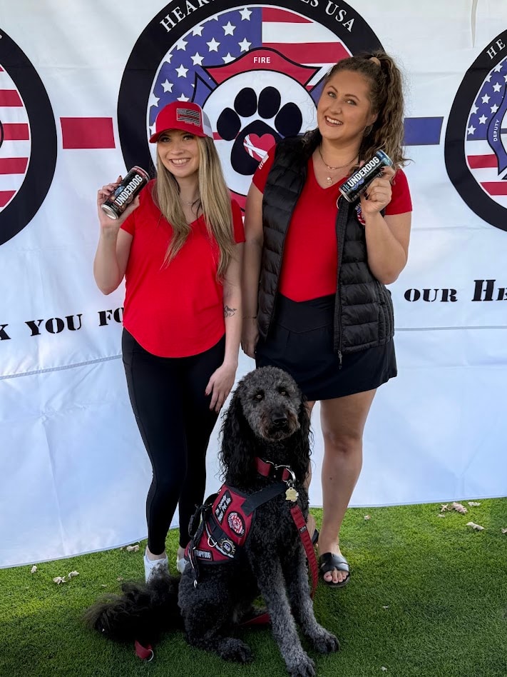 Two women with service dog at Hearts 4 Heroes event
