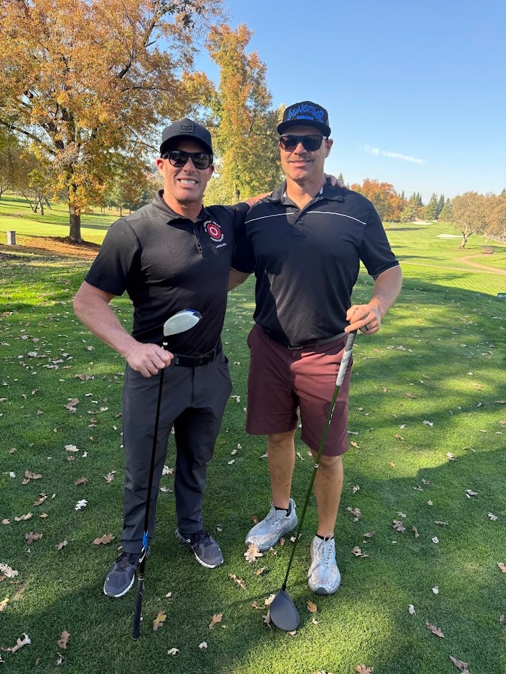 Two people on golf course in autumn