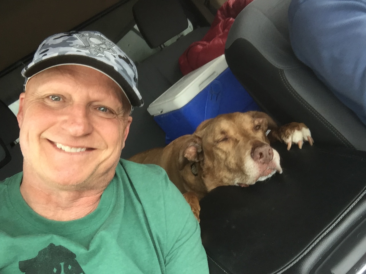 First responders posing with dogs outdoors